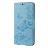 Peňaženkové kožené puzdro EMBOSSED na Xiaomi Redmi 10C – Modrá